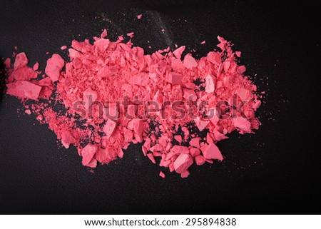 Background with colorful powder. Crushed eyeshadow on black background. Abstract  background