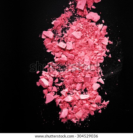 Background with colorful powder. Crushed eyeshadow on black background. Abstract background