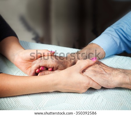 Care is at home of elderly. Senior man, with their caregiver at home. Concept of health caring for elderly old people, disabled. Elderly man.