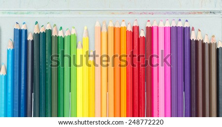 Crayons. Colored Pencils. colored pencils on white background and wood chips