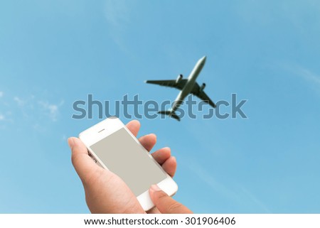 hand hold and touch screen smart phone,tablet,cellphone in the airport terminal
