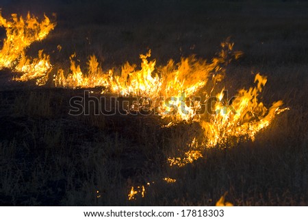Farmers doing a seasonal burning of the prairie