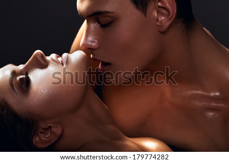 Sexy passion couple, beautiful young female and male faces closeup, studio shot