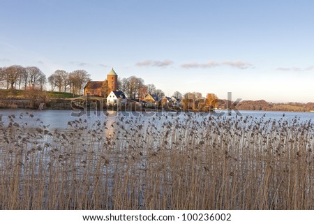 The lake at Skanderborg, Denmark. The Castle Church on the hill. Shot taken just before sunset.