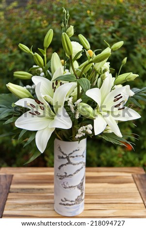 Closeup on white lilies in a vase