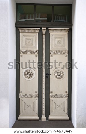 Old double door with wood carving. Shot from Lübeck, Germany