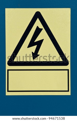 Yellow and black high voltage sign with copy space