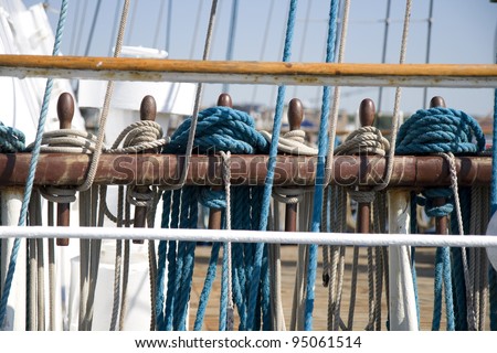 Ropes on belaying pins on board a sailing ship