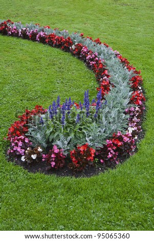 Flowerbed on a lawn in a park in Salszburg, Austria