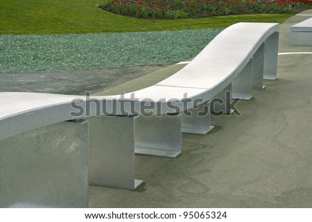 Modern bench made of concrete. Shot from a park at the palace at Schwerin, Germany