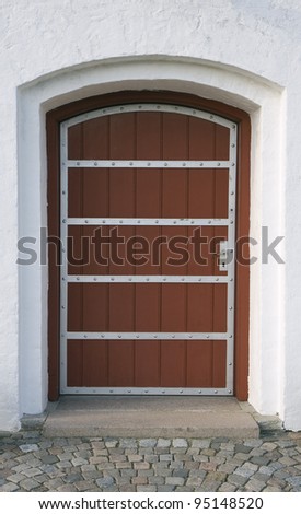 Red church door. From the small church at Nolev, Denmark