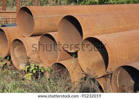 Rusty steel pipes found on a scrap yard. Can be used as background