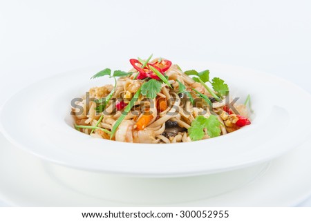 Close up  Plate of Seafood Pasta with vegetables, decorated with herbs on the white plate isolated