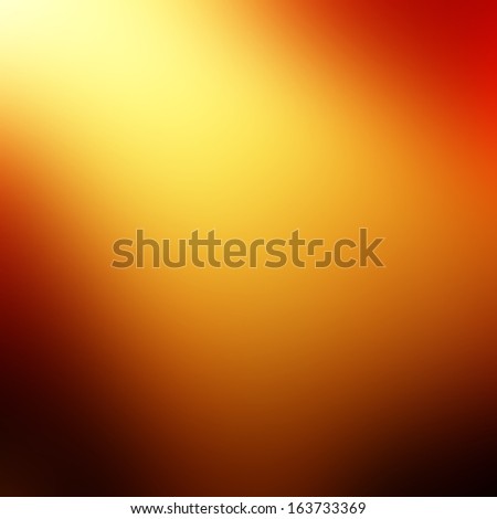 fire: abstract blurred orange background with a hightlight in it