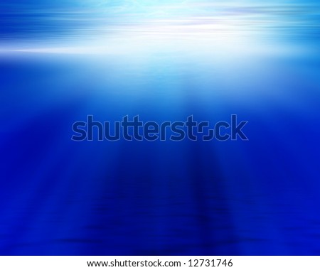 blue ocean floor and surface with light shining through the surface