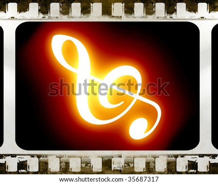 old film strip with a music note in it