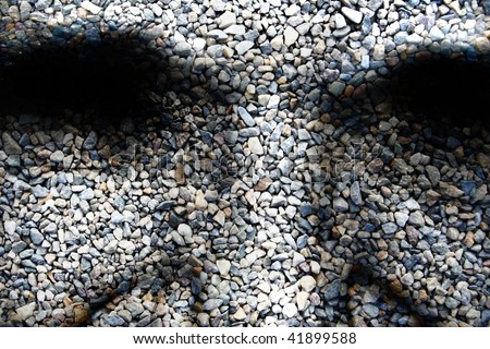 abstract face on a stone like background