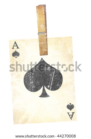 old playing card with wooden clothes peg