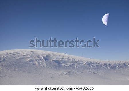 Fantastic beautiful moon shines(covers) snow desert