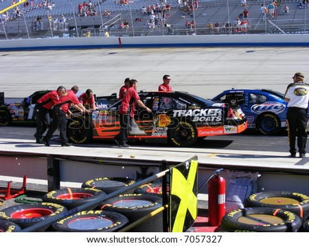 nascar`s jeffery earnhardt`s car getting pushed onto the track