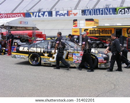 DOVER, DE - MAY 31: Ryan Newmans car gets pushed to inspections before the race at the monster mile Nascar race  in Dover, DE on May 31, 2009.