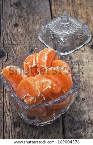 broken into slices tangerine in a glass vase