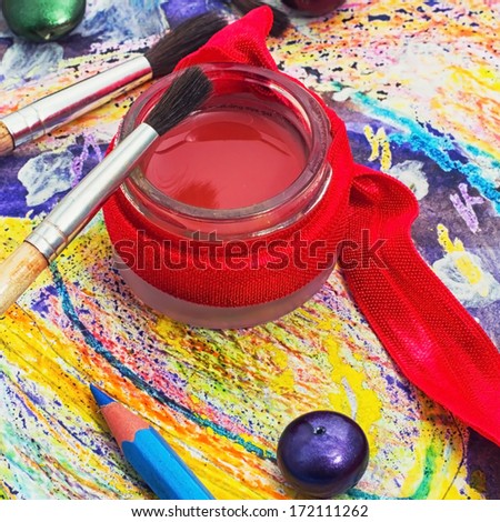 red paint,brushes and pencils