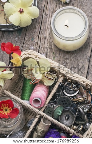 full wicker basket with sewing tools and accessories