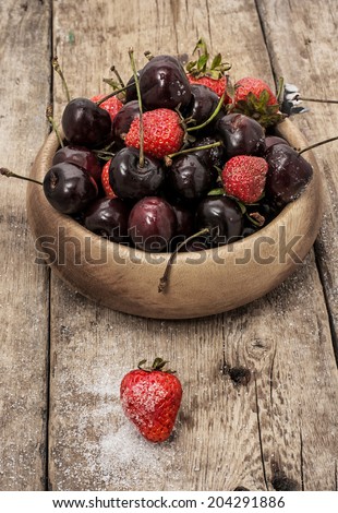 fruit  cherry of  bowl on wooden background