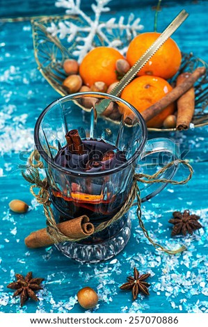 warming drink mulled wine on bright blue background.Photo tinted