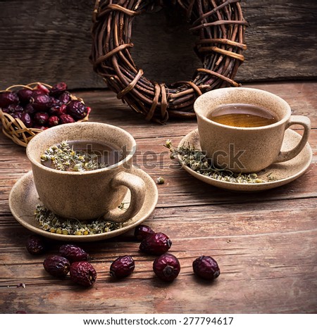 ceramic cups brewed tea with rosehip and chamomile