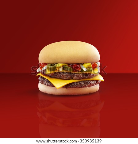 beef burger with cheese, jalapeno, pickle, onion, and mustard in a red background