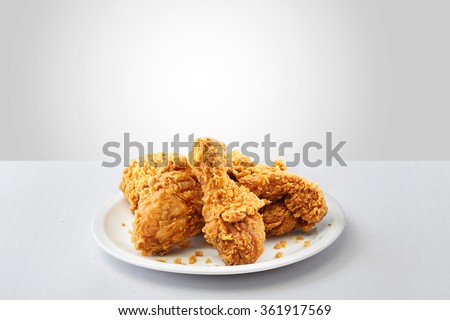 crispy kentucky fried chicken in a white background