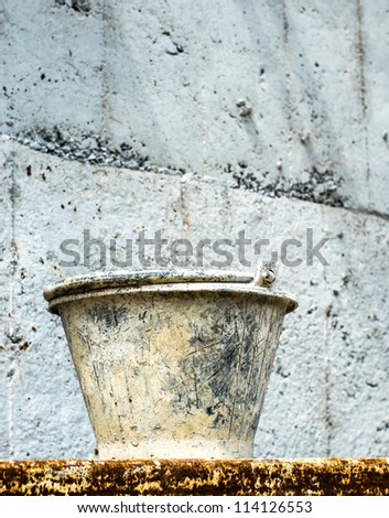 Pail for about cement work at construction site.
