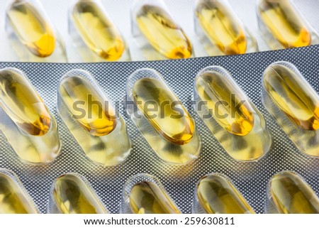vitamin capsules close up background.