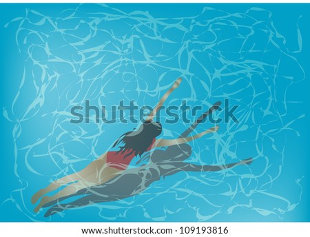 woman is swimming under clear blue water