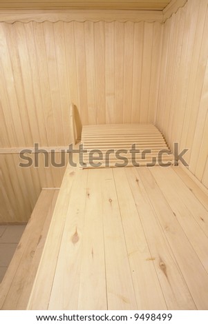 wooden bench of steam room in sauna