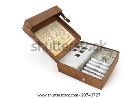 Germany in the Second World War. Standard military first-aid kit and its contents including aluminum pipes for pills and anesthetic.