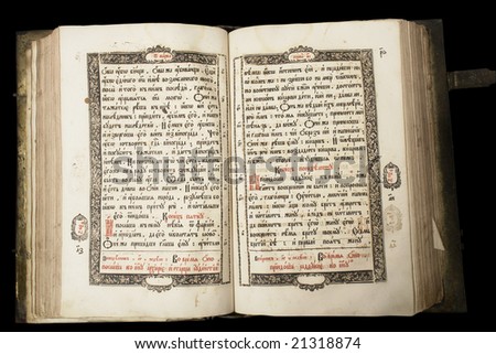 Beautiful old book (end of 17th century) on the dark background with clipping path. Russia