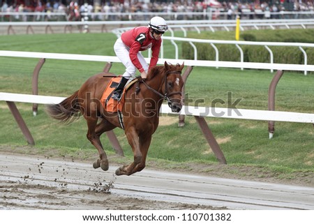 SARATOGA SPRINGS, NY - JULY 27: Jockey Jose lezcano aboard Back Away in the Post Parade for the fifth race on July 27, 2012 at Saratoga Springs, New York