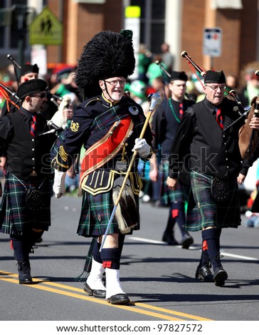 ALBANY, NY - MARCH 17: Albany City Drum Major leads the Albany City Bag Pipe band in the 2012 St. Patrick\'s Day Parade on March 17, 2012 in Albany, New York.