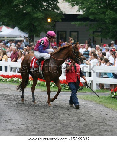 SARATOGA SPRINGS - August 2: Porte Bonheur heads for the post parade with Jockey Ramon Dominguez in the saddle for the running of \