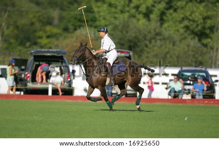 SARATOGA SPRINGS - August 27: Unidentified Polo Player and Horse galloping down the field during match at Saratoga Polo Club August 27, 2008 in Saratoga Springs, NY.