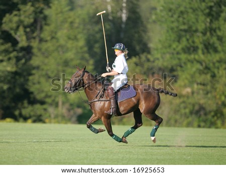 SARATOGA SPRINGS - August 27: Unidentified Polo Player after scoring during match at Saratoga Polo Club August 27, 2008 in Saratoga Springs, NY.