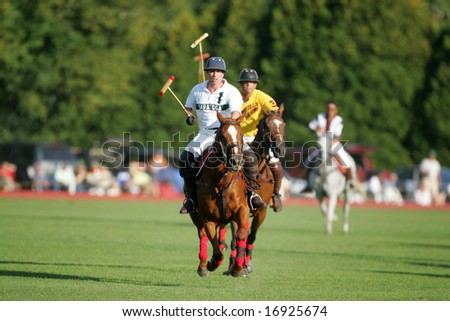 SARATOGA SPRINGS - August 27: Unidentified Polo Players and Horse galloping in fast Action during match at Saratoga Polo Club August 27, 2008 in Saratoga Springs, NY.