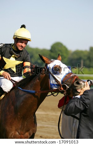 SARATOGA SPRINGS - August 24: Kent J. Desormeaux Aboard Sandstorm Cat in Front of the Winners Circle after the Seventh race August 24, 2008 in Saratoga Springs, NY.