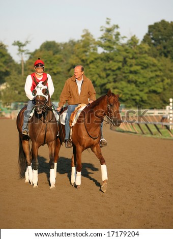 SARATOGA SPRINGS - August 23: Trainer  Barkley Tagg Rides Funny Cide on the main Track the morning of the Travers Stakes August 23, 2008 in Saratoga Springs, NY.
