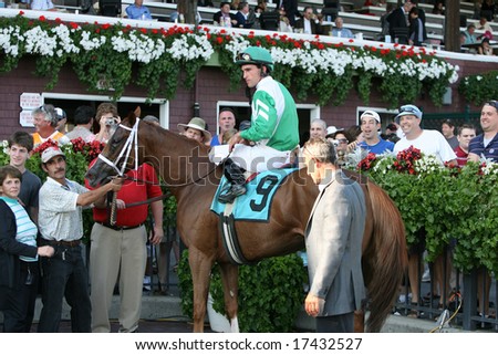 SARATOGA SPRINGS - August 22: Sunshine for Life with Ramon Dominguez Aboard in the Winners Circle After the Eighth Race August 22, 2008 in Saratoga Springs, NY