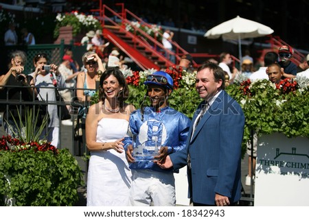 SARATOGA SPRINGS - September 1:  Tommasi\'s Trainer and Jockey Collect the Trophy for a Win in the Fourth Race on September 1, 2008 in Saratoga Springs, NY