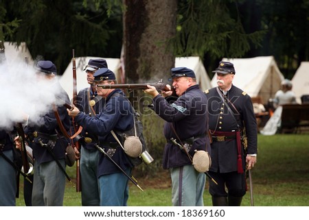 MENANDS - September 13: Union Soldiers Single Fire Their Rifles During a Civil War Reenactment at the Albany Rural Cemetery on September 13, 2008 in Menands, NY.